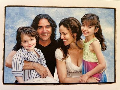 Amy Brenneman is holding Charlotte Tucker Silberling and Brad Silberling is holding Bodhi Russell Silberling.